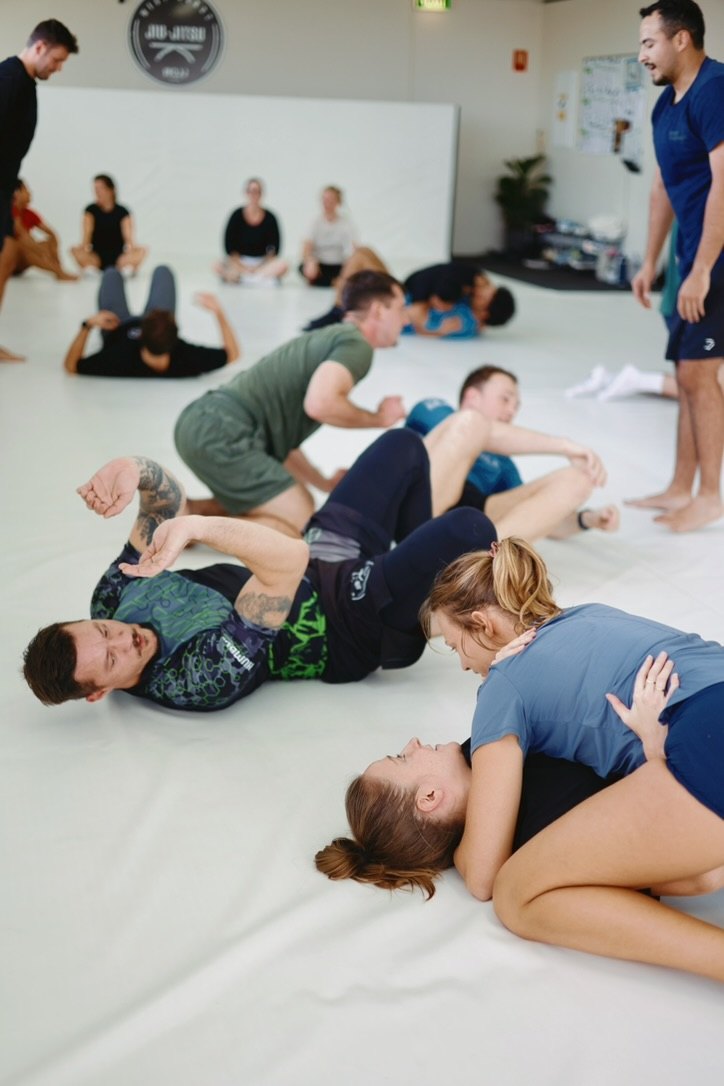 Newbies practising jiu jitsu drills on the mats at West Coast Jiu Jitsu