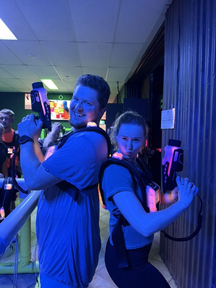 Two newbies posing at a laser tag social
