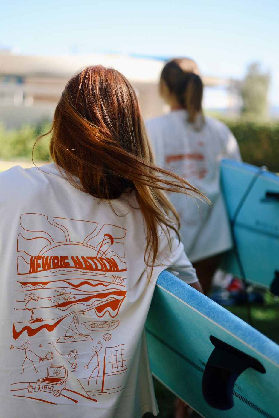 Newbie Nation tee, back print, worn at a surf social